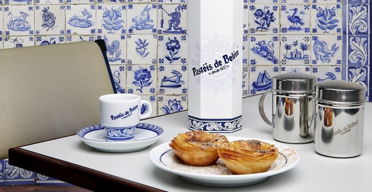 two pastéis de nata and a coffee at pastéis de belém in lisbon